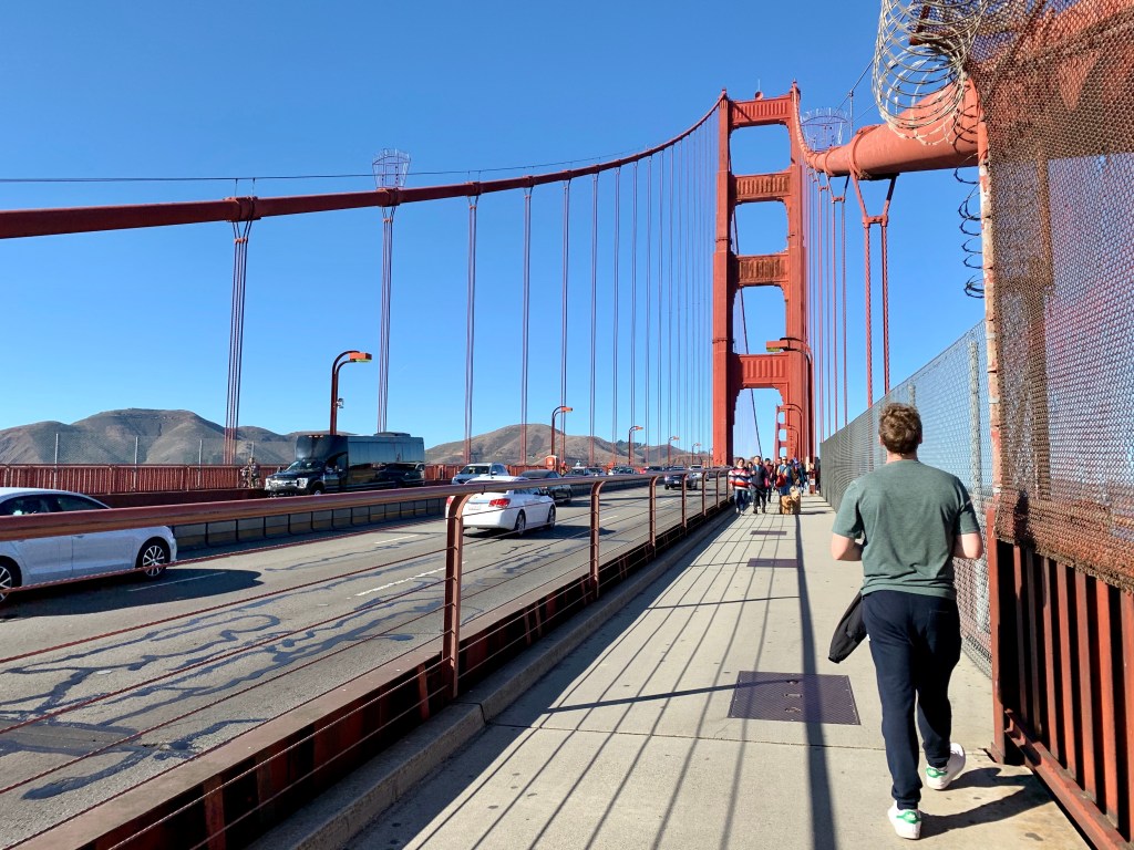 Walking along Golden Gate Bridge San Francisco